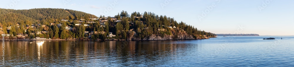 Beautiful panoramic view of the luxury homes with an Ocean View during a vibrant sunset. Taken in Horseshoe Bay, West Vancouver, British Columbia, Canada.