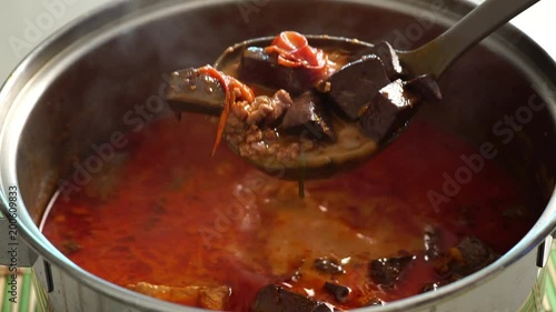 Northern Thai style red curry soup with pork and jelly blood.
