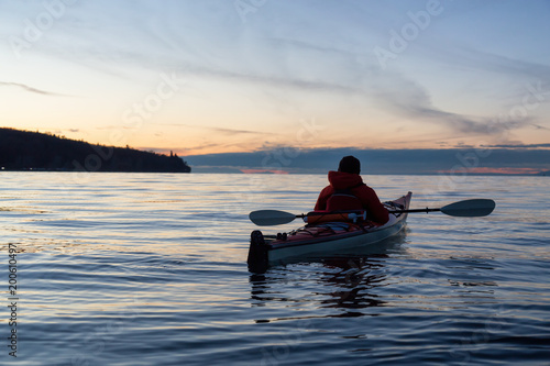 Ocean Kayaking during Sunset. Taken in Vancouver, British Columbia, Canada. Concept: sport, adventure, fitness, vacation, holiday.