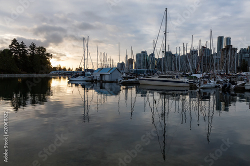 Sail Boats in a marina during a vibrant sunrise. Taken in Stanley Park, Coal Harbour, Downtown Vancouver, BC, Canada. © edb3_16