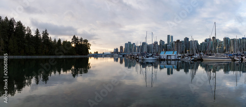 Sail Boats in a marina during a vibrant sunrise. Taken in Stanley Park, Coal Harbour, Downtown Vancouver, BC, Canada.