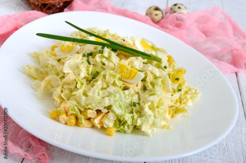 Light spring dietary salad from Chinese cabbage, cheese, quail eggs, corn. Proper nutrition.