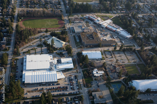 Coquitlam, Greater Vancouver, British Coquitlam, Canada - March 17, 2018: Aerial view of Centennial Secondary School and residential neighborhood.