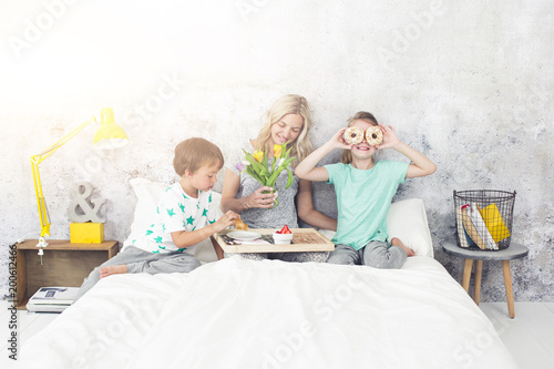 Mother´s Day - children surprise their mum with breakfast in bed