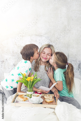 Mother´s Day - children surprise their mum with breakfast in bed