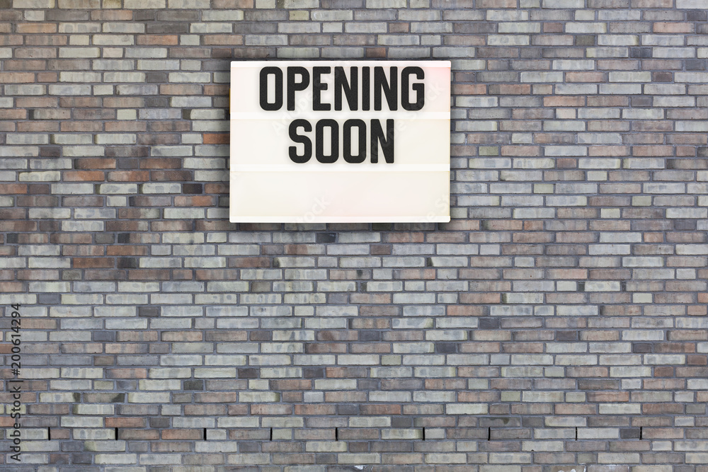 Brick wall with empty light box for marketing message Brick wall with empty light box for marketing message