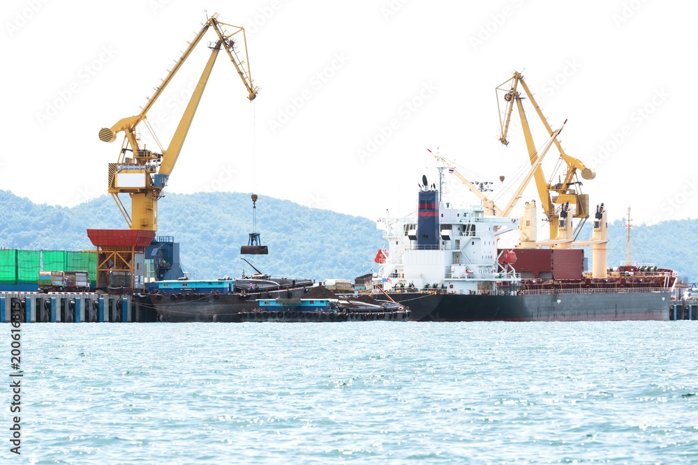 Shipping port, Crane shipping goods into cargo ship at port cargo for logistic import export in thailand