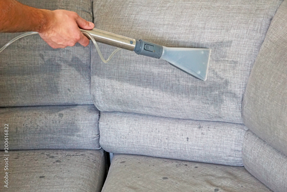 Washing vacuum cleaner cleans the sofa