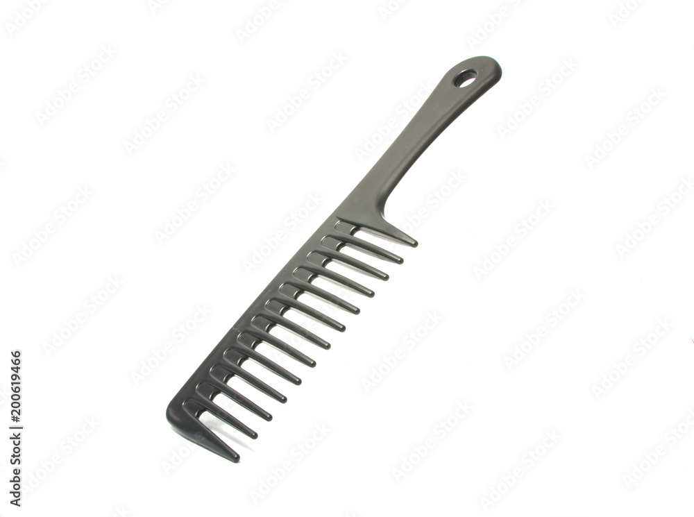 Black plastic comb isolated on the white Black plastic comb isolated on the white