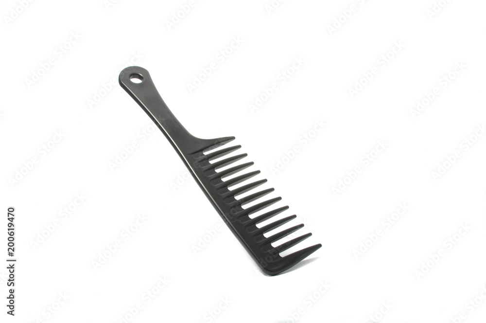 Black plastic comb isolated on the white Black plastic comb isolated on the white