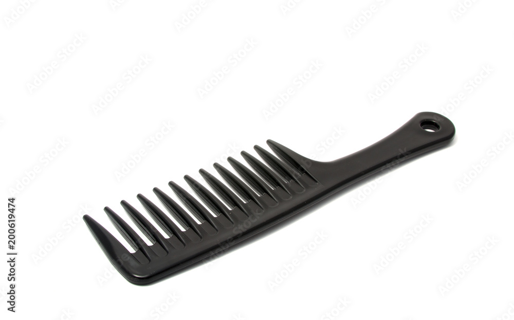 Black plastic comb isolated on the white Black plastic comb isolated on the white