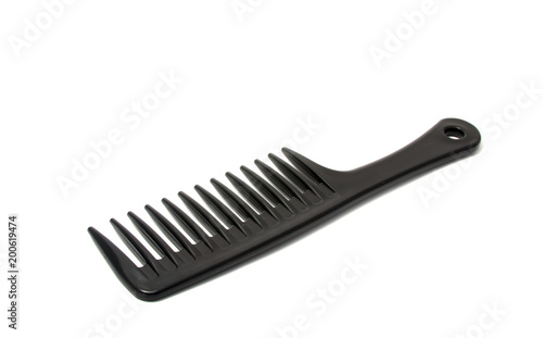 Black plastic comb isolated on the white