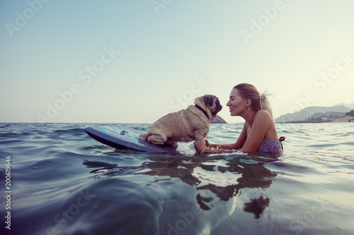Photography Girl with funny dog in the sea