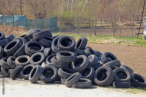 Jaslo/Yaslo, Poland - april 12, 2018: Sweet rubber tires for various cars, trucks and tractors. Technology of automotive industry. Recycling of consumables. Preparation for the season. Car repair shop photo