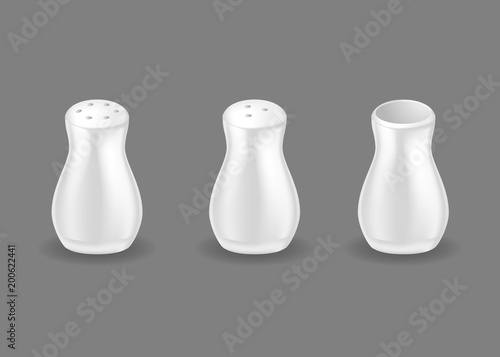 Set of white hand mills, containers for spices, pepper, salt.