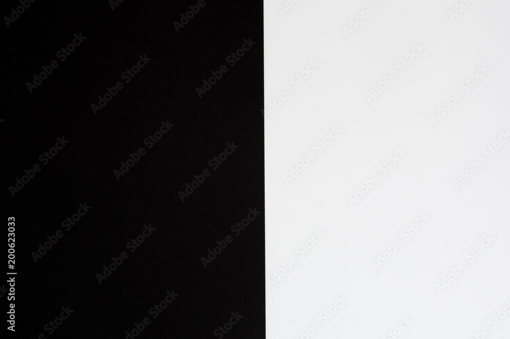Black and white pastel color paper geometric flat lay background.
