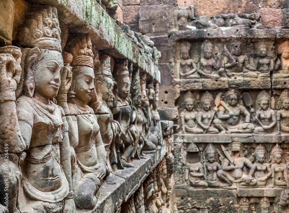 Women sculptures at Angkor temple.