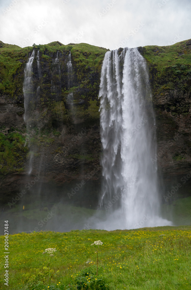 Waterfall Seljalandsfoss in the south coast of Iceland. Waterfall Seljalandsfoss in the south coast of Iceland.