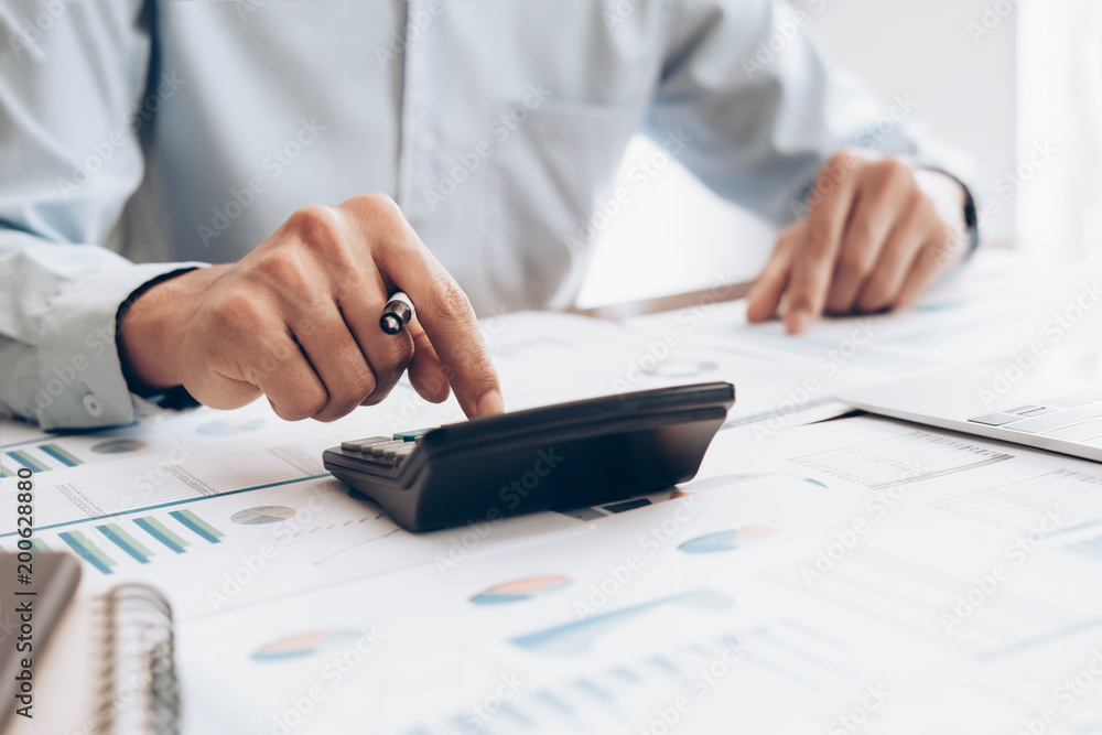 Fototapeta premium Male accountant or banker use calculator.
