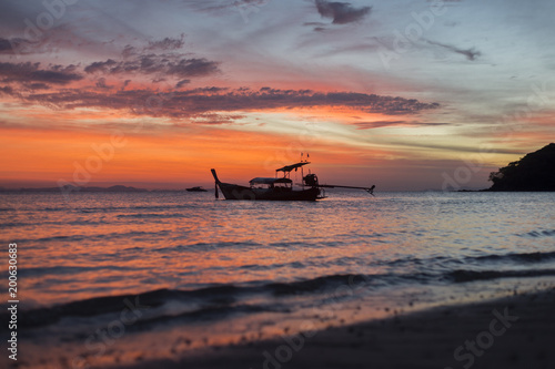 Boat on ocean sunrise 