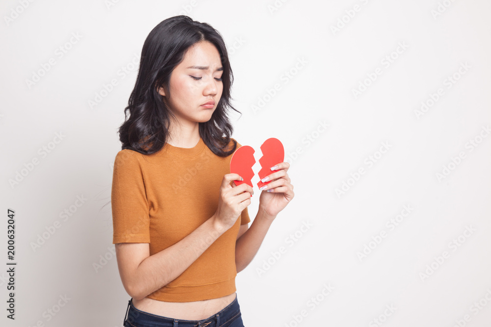 Beautiful young Asian woman with broken heart. Beautiful young Asian woman with broken heart.