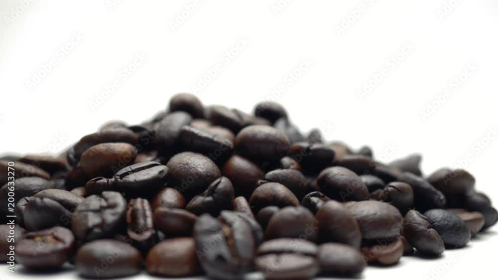 Slow rotation of the heap of coffee beans. Close up of coffee beans. Loopable rotation. Rotates plate with coffee beans. 4K Slow rotation of the heap of coffee beans. Close up of coffee beans. Loopable rotation. Rotates plate with coffee beans. 4K