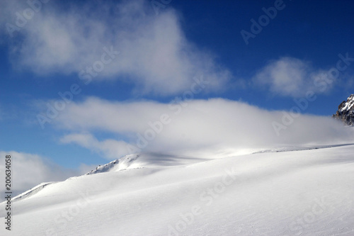 Winter landscape with snow covered peaks of Caucasus mountains, view from Elbrus mountain, Russia