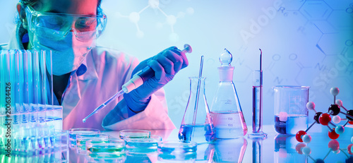 Chemistry Laboratory - Woman With Pipettes And Test Tubes
 photo