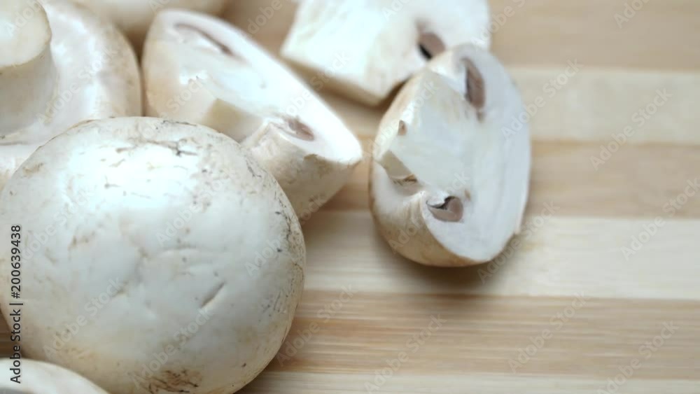 Champignon mushroom on white background. On the rotating. 4K Champignon mushroom on white background. On the rotating. 4K