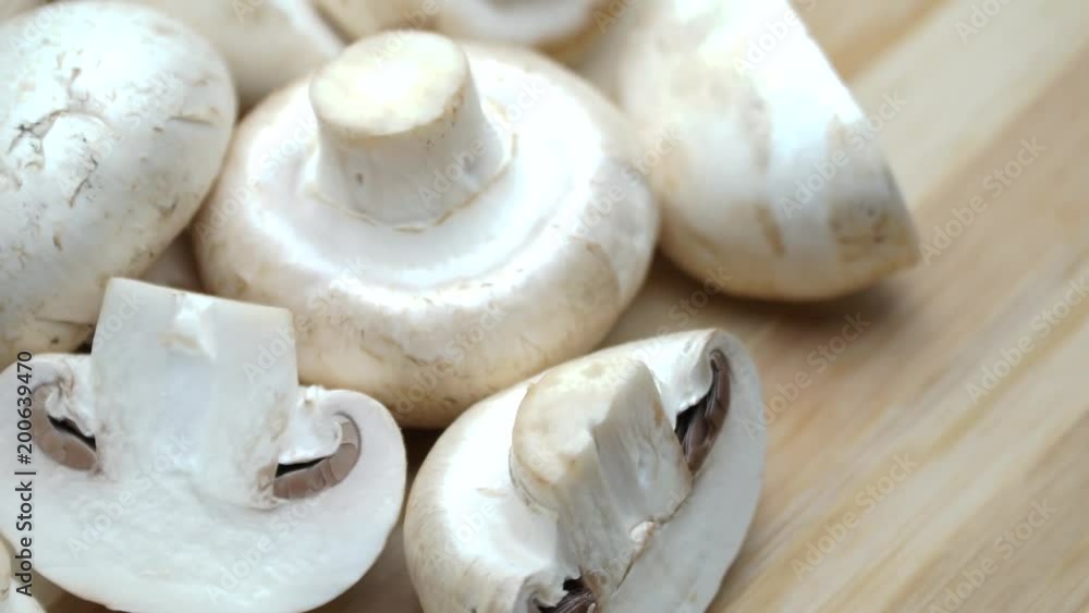 Champignon mushroom on white background. On the rotating. 4K Champignon mushroom on white background. On the rotating. 4K