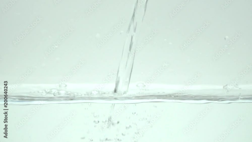 Slow motion shot of water pouring. Slow motion shot of water pouring.