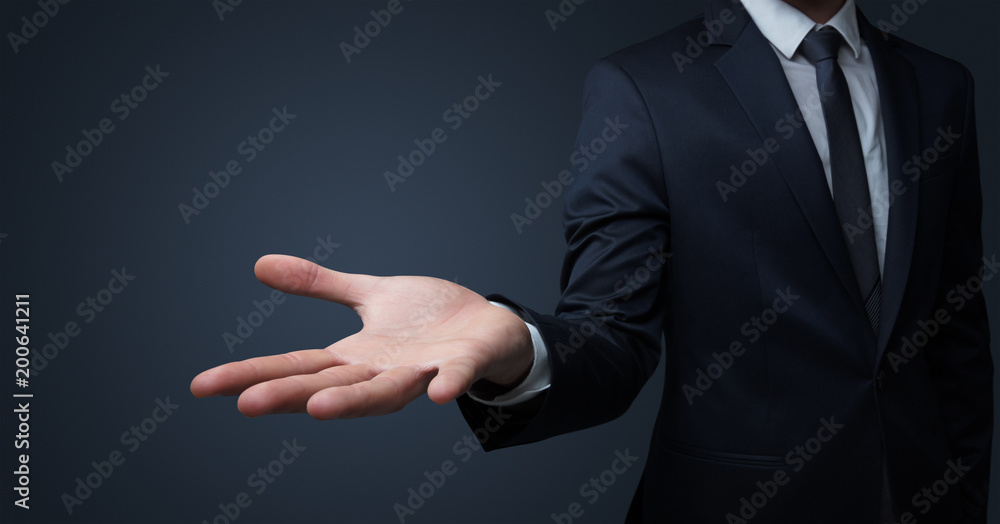 Businessman without head holding something without theme Businessman without head holding something without theme
