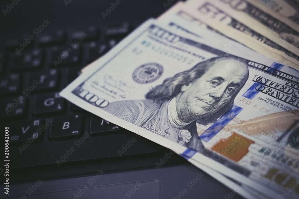 Dollar currency, American Dollars Cash Money with Keybord Computer, Business Success concept. Dollar currency, American Dollars Cash Money with Keybord Computer, Business Success concept.