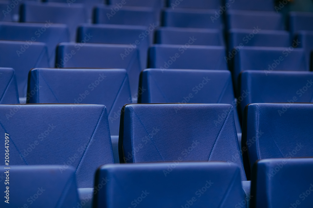 Fototapeta premium Many rows of empty armchairs. Blue, elite seats, comfortable armchairs. Conference room, theater or cinema.