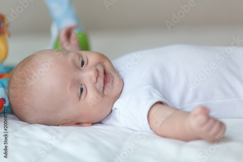 Bright portrait of a sweet little 4 months old newborn baby boy