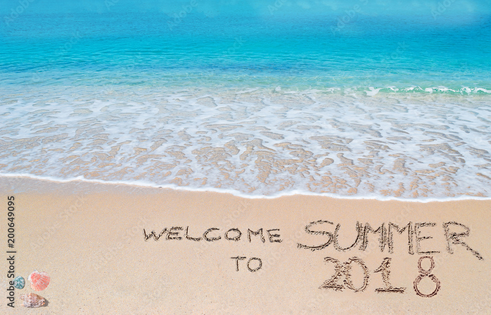 Fototapeta premium welcome to summer 2018 written on a tropical beach