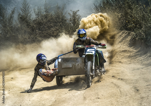 motocross motorbike with sidecar motorcycle trailer dust dirt photo