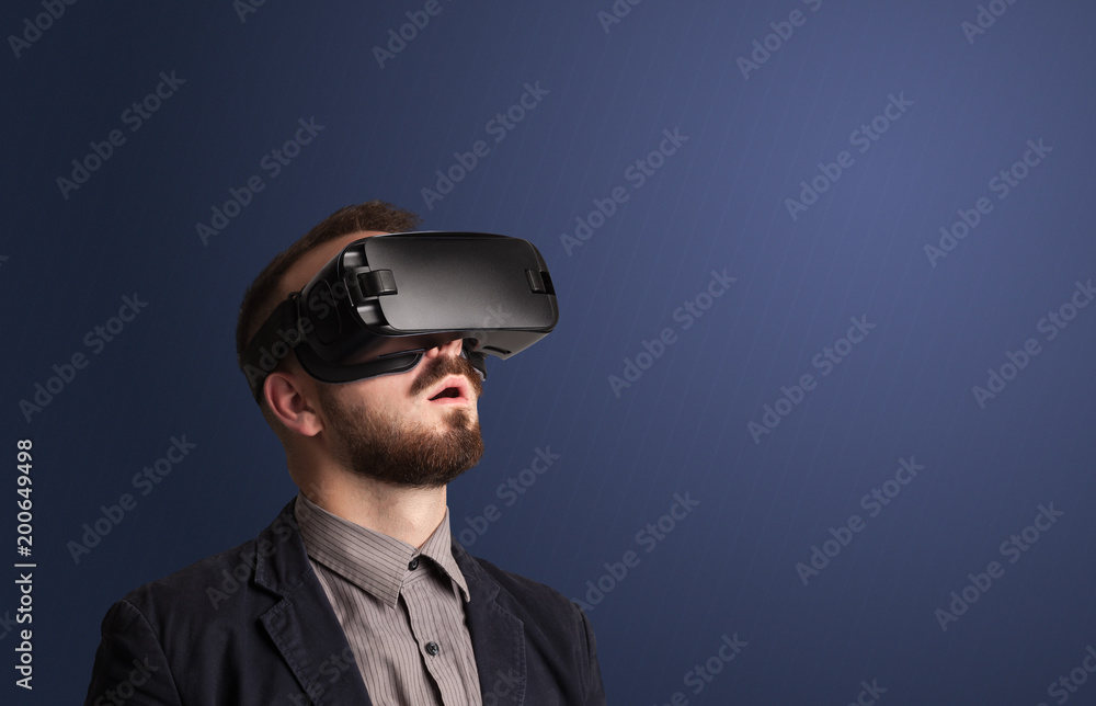 Amazed businessman with virtual reality goggles Amazed businessman with virtual reality goggles