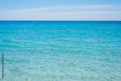 Fototapeta Naklejka Na Ścianę i Meble -  Turquoise water under a clear sky in Sardinia