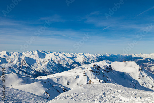 Amazing view to Alps from the mountain top at the french ski resort Three Valleys, Meribel, Courchevel, France. © umike_foto