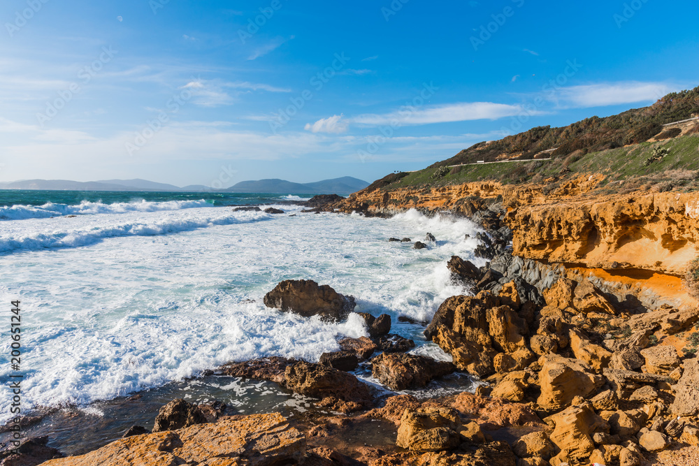 Waves by Alghero rocky coast