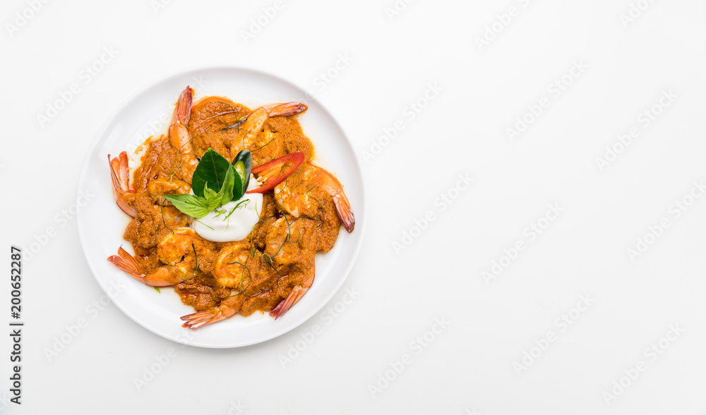 Curry-fried shrimps isolated on a white background. Thai food. Copy space. For design. Thai food concept. Curry-fried shrimps isolated on a white background. Thai food. Copy space. For design. Thai food concept.