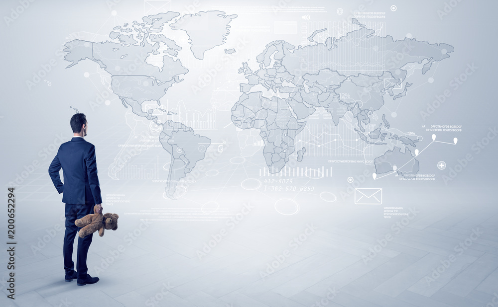 Businessman standing with his back and looking at a worldwide map with objects in his hand
