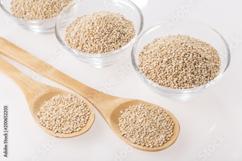Quinoa grains in bowl isolated on white background, Chenopodium quinoa