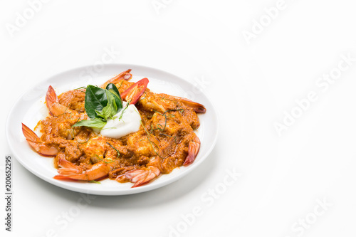 Curry-fried shrimps isolated on a white background. Thai food. Copy space. For design. Thai food concept.