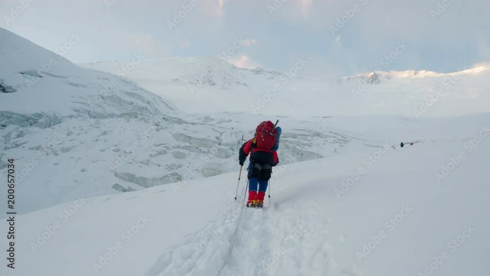 Extreme mountain climbing in freezing weather at Lenin Peak in Kyrgyzstan Extreme mountain climbing in freezing weather at Lenin Peak in Kyrgyzstan