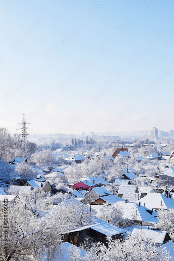 A fairy tale in the city. Magic winter period. Snowy roofs after a snowstorm.