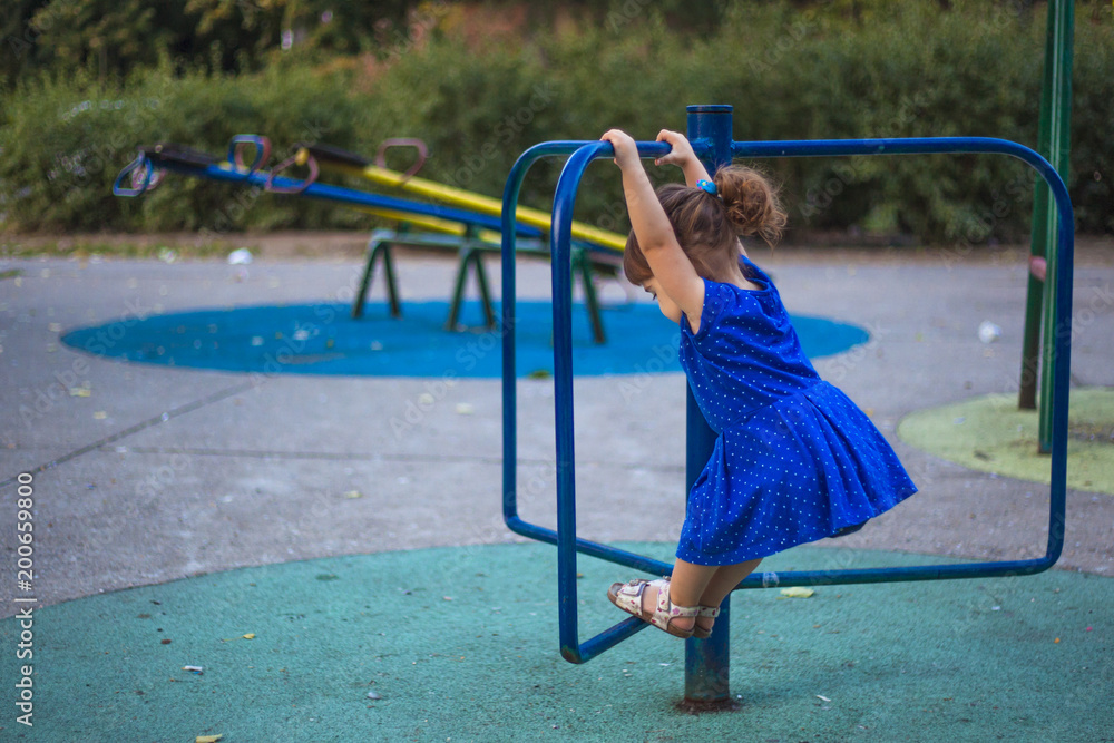 Fototapeta premium Little girl at the playground