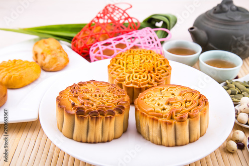 Mooncake for Chinese mid-autumn festival celebration, wih ingredients and tea.