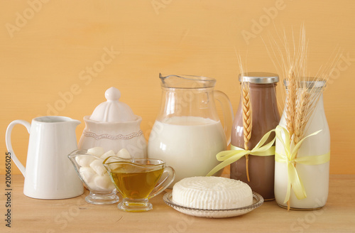 image of dairy products over wooden background. Symbols of jewish holiday - Shavuot.
